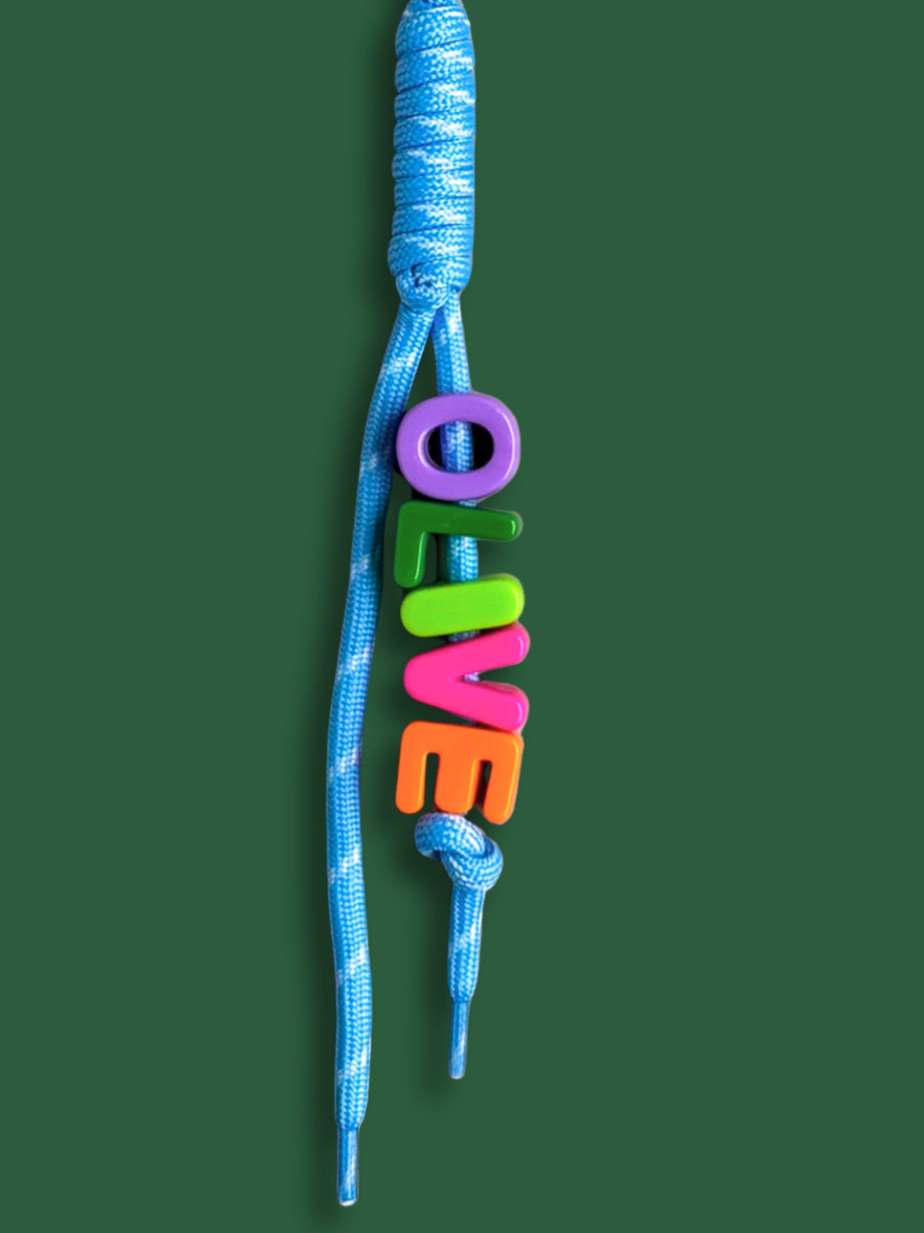 Personalised bag charm with letter beads spelling OLIVE in purple, green, lime, pink and orange, threaded on a blue and white fleck knotted cord, with a yellow carabiner clip on a green background. Made by Bugalugs in Melbourne.